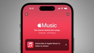 A phone on a gray background with the Apple Music app