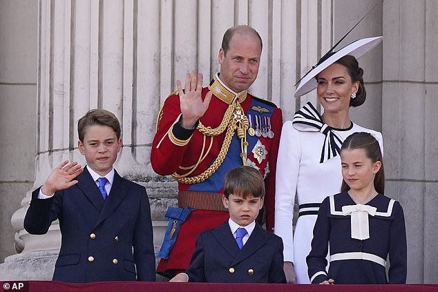 WALES: Prince George waves from the balcony of Buckingham Palace, accompanied by his father Prince William, brother Prince Louis, his mother the Princess of Wales, and sister Princess Charlotte