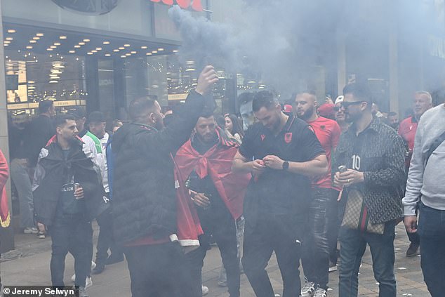 The fans - who had previously lit gray and red flares - were later searched for weapons