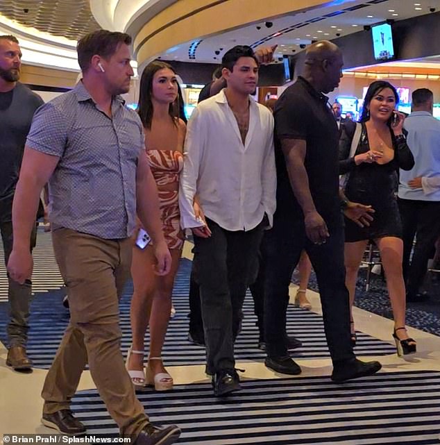Garcia was flanked by security as he walked through the Vegas hotel on Friday evening