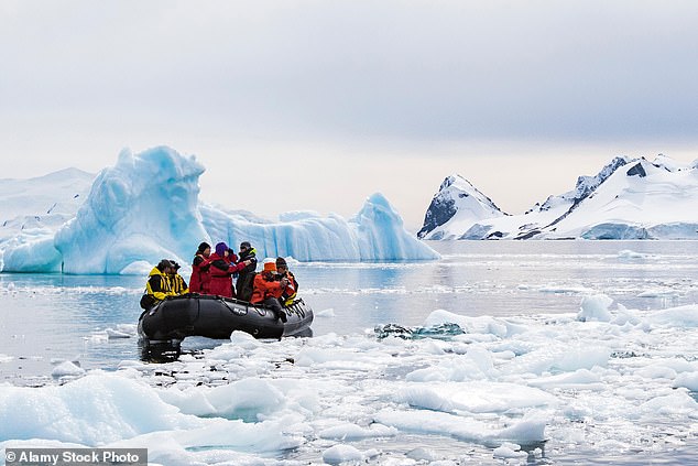 Tourists visit Antarctica in a Zodiac vessel, which allows them to go ashore and explore bays