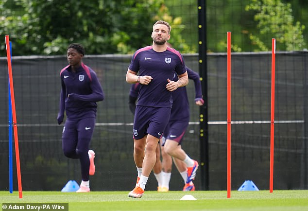 Luke Shaw (centre), England's natural left back, is back in full training but is not expected to play on Sunday