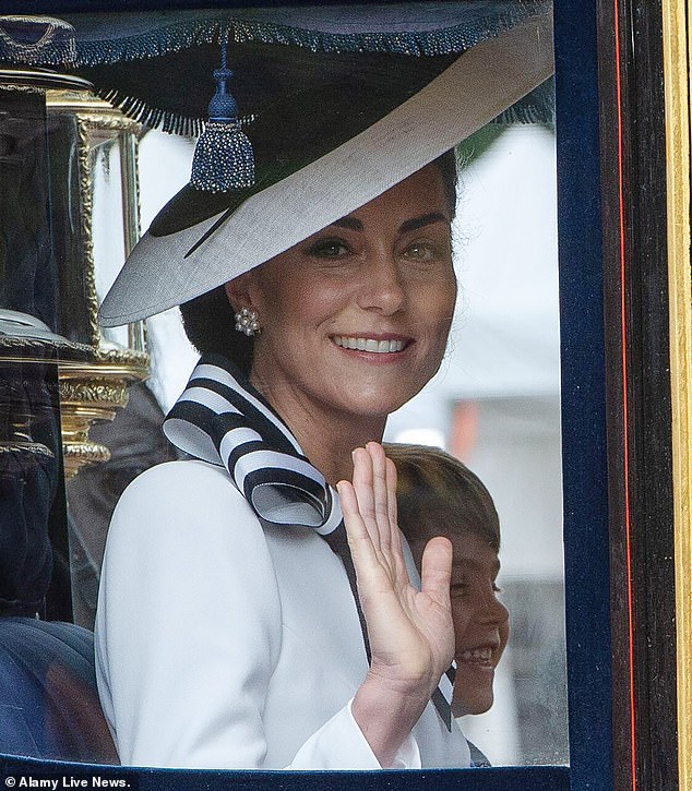 The Princess of Wales waves from her carriage next to her three children, including the mischievous Prince Louis