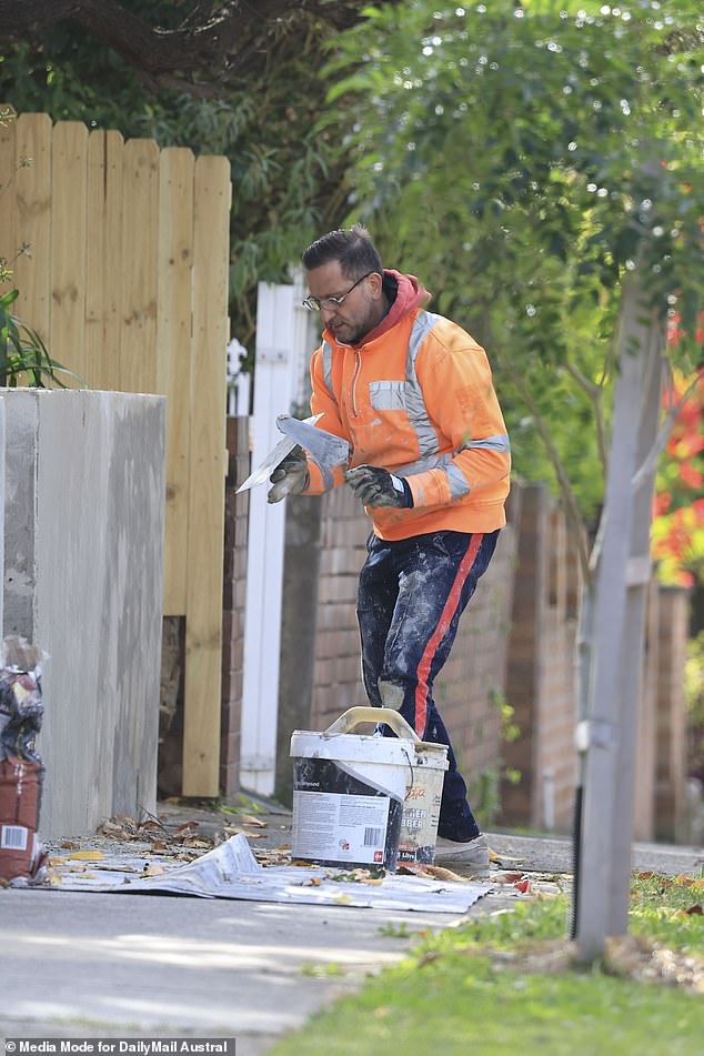 Salvatore Coco was put to work on Wednesday creating a concrete wall at a building in Sydney's west