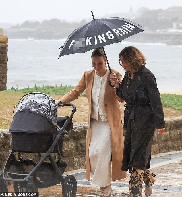 At one point, Simone's mother Margaret was seen covering Simone and her baby with the umbrella