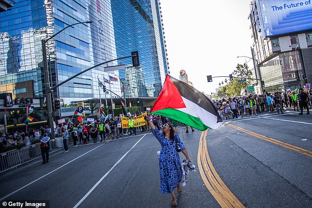 As at numerous other demonstrations this year, demonstrators could be seen waving Palestinian flags