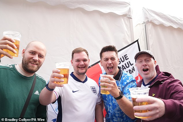 A group of English supporters toast their team's chances in Germany