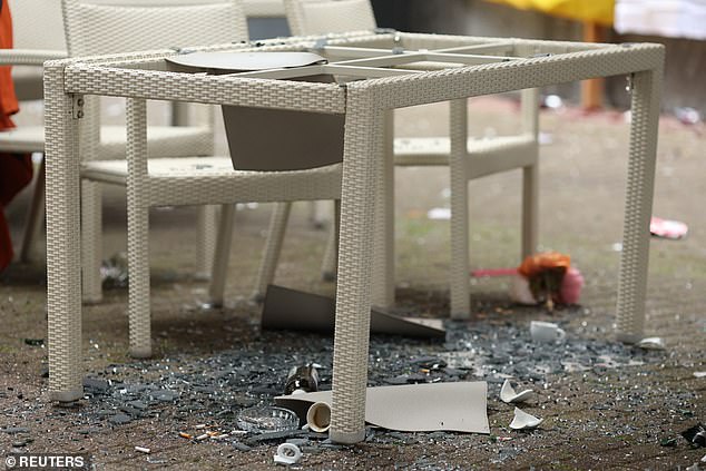 Tables and chairs were destroyed during the violent scenes, almost five hours before the match was due to start