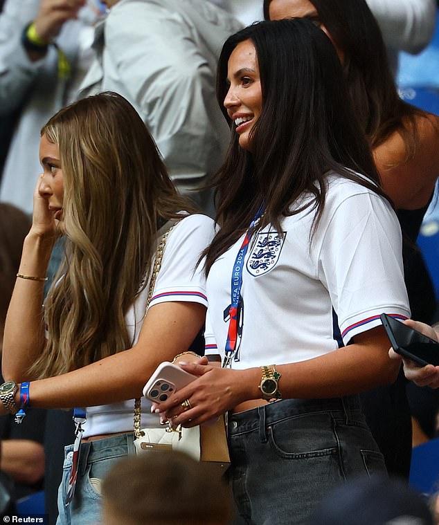 Ollie Watkins' partner Ellie Alderson (right) smiles during the build-up to kick-off
