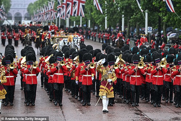People attend the 'Trooping the Colour' parade held for King Charles III's official birthday in London on June 15