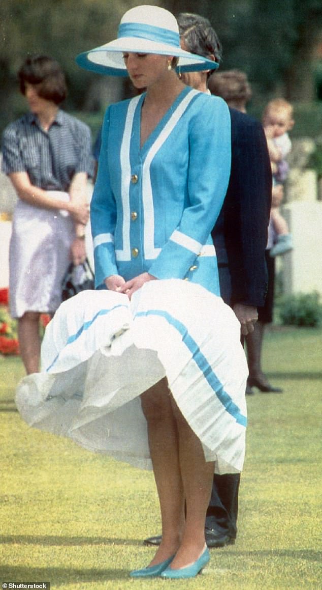 Princess Diana maintains her composure as her hemline is lifted by the wind during a tour of Egypt in 1992