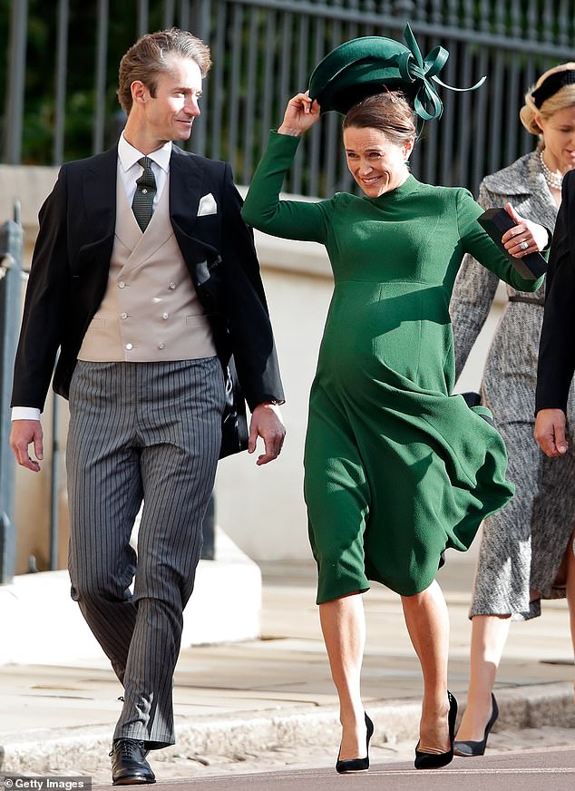 Pregnant Pippa Middleton manages to grab her hat just in time