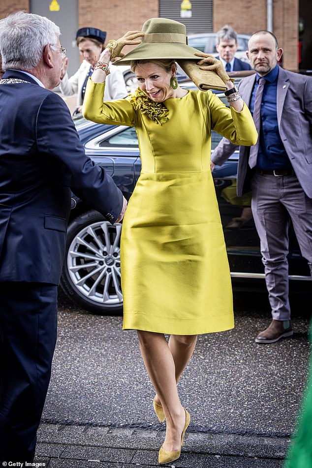 Queen Máxima holds her hat due to strong winds upon her arrival at the celebration of the 10th anniversary of the Language at Sea Foundation in April