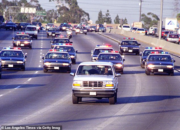 California Highway Patrol pursues Cowlings, driving, and Simpson, hiding behind the Bronco