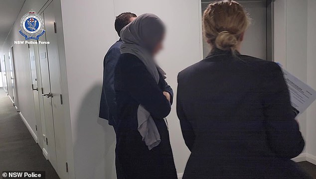 Zahra Rachid (pictured during her arrest) was charged with sixteen counts of dishonestly obtaining financial advantage by deception