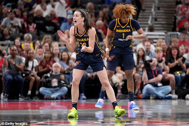 Caitlin Clark celebrates a basket during the first half against the Chicago Sky