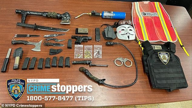 According to police, a loaded 9mm gun, ammunition, knives, a machete, a stun gun, a whip, a bulletproof vest with an NYPD patch in it, an MTA vest and a baton with disturbing writing were discovered.