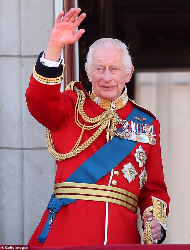 King Charles waves from the balcony of Buckingham Palace during Trooping the Color on Saturday