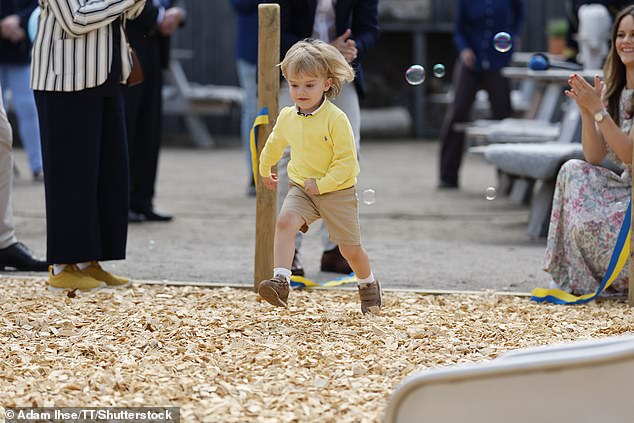 The energetic prince was not afraid to try out all the activities offered in the new playground