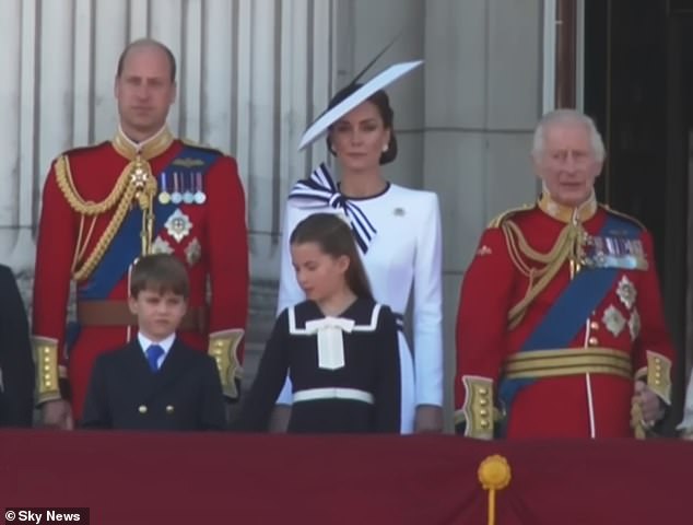 As the national anthem started playing, Princess Charlotte was seen telling her brother to 'put his hands down'