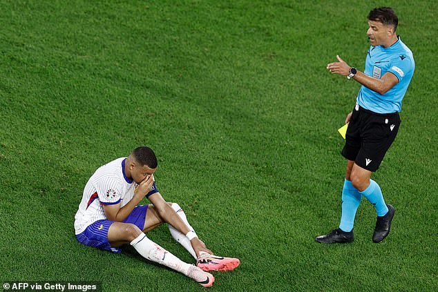 The referee gave Mbappé a yellow card after the Frenchman reentered the field and sat down