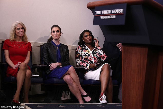 Omarosa (right) is pictured in the White House briefing room in February 2017, a month into the Trump administration, next to adviser to the President Kellyanne Conway (left) and Hope Hicks (center), the director of strategic communications