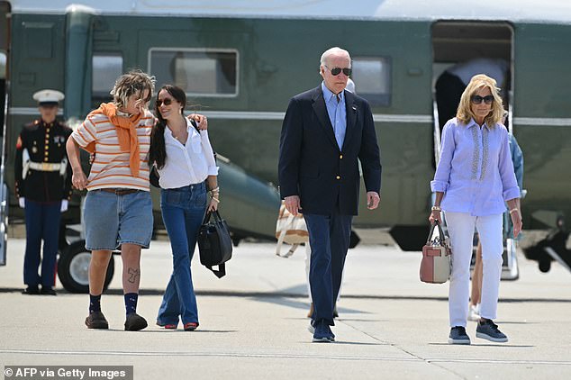 President Joe Biden (center right) and first lady Jill Biden (right) walk toward Air Force One, followed by granddaughter Maizy (left) and first daughter Ashley Biden (center left) as they depart Los Angeles on Sunday