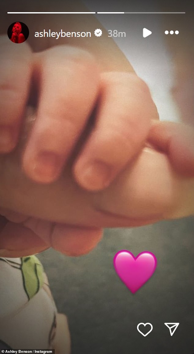 Benson recently debuted their newborn via her Instagram Story on February 29, sharing a photo of the baby girl's tiny hand holding a finger, along with a pink heart emoji