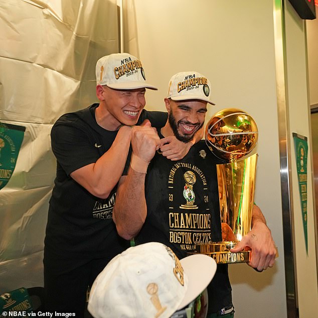 Jayson Tatum arrived in the locker room with the Larry O'Brien trophy in his hands