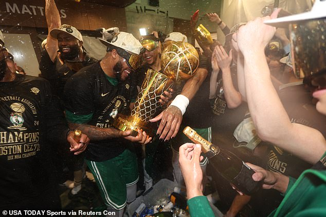 And soon the trophy was the center of a raucous Celtics celebration on Monday night
