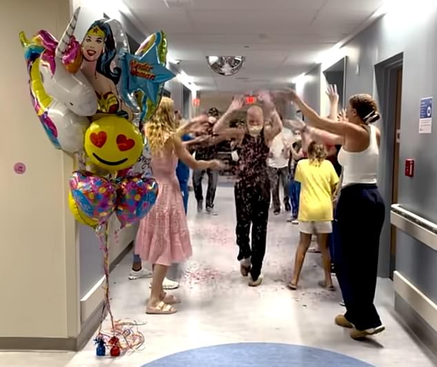 Then her nurses and doctors, as well as her friends and family members, all lined up in the hallway and as she walked down the hallway, everyone cheered and threw confetti at her.