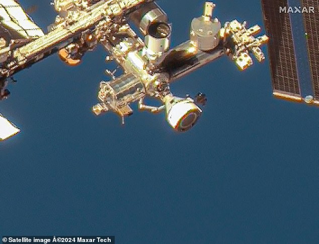 This image courtesy of Maxar Technologies, taken on June 7, 2024, shows the Boeing Starliner spacecraft docked in the outer harbor of the International Space Station (ISS) on the station's Harmony module.  Because Starliner is docked to the ISS, astronauts can still hop on and off Starliner whenever they want