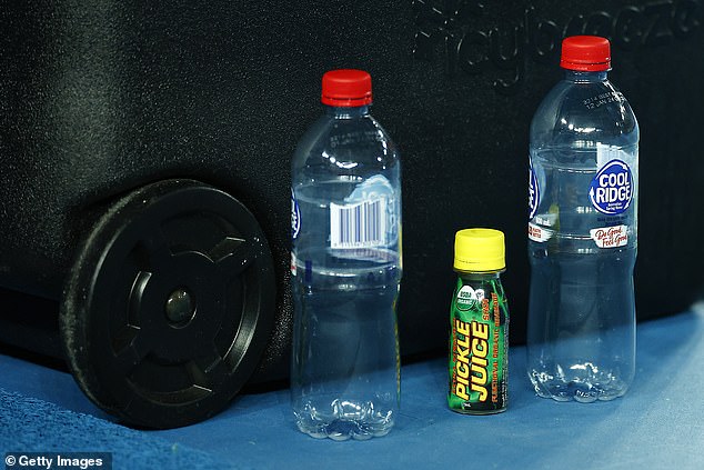 Trippier drank pickle juice, which helps athletes prevent cramps.  Above, tennis player Daniil Medvedev places a bottle of drink on his table during the 2022 Australian Open