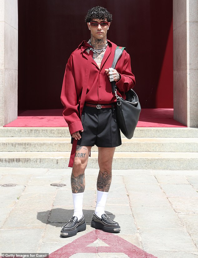 Pictured: Italian rapper Tony Effe seen arriving at the Gucci Milan Fashion Week show in shorts