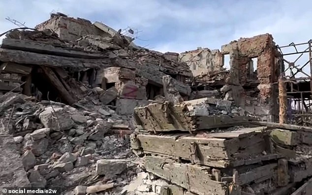 Debris and Z graffiti are seen in a destroyed Ukrainian village in Donetsk, Ukraine