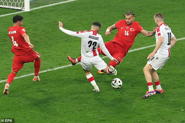 Georgia found the equalizer shortly afterwards, with Georges Mikautadze (second from left) hitting in from the penalty area