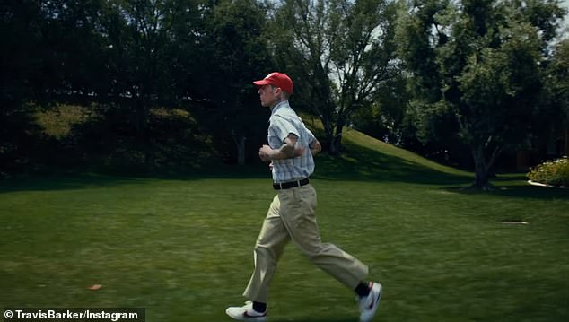 The Blink-182 drummer, 48, reenacted scenes from Forrest Gump's epic run across the United States, wearing a similar short-sleeved plaid shirt, khaki pants and a red cap.