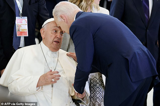 Trump criticized Biden, a Catholic, for an awkward moment when he pressed his forehead against Pope Francis' head as they met in Italy on June 14