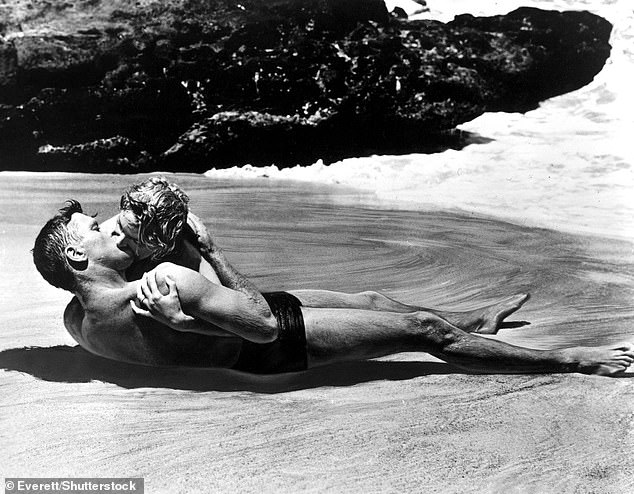 The couple recreated Burt Lancaster and Deborah Kerr's iconic beach kiss scene in the 1953 classic From Here to Eternity (pictured)