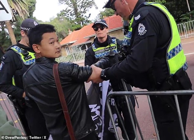 The Tibetan protester was escorted from Kings Park by WA police officers