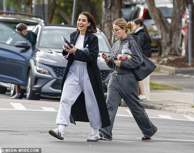 The pair were crossing the road after going to an Officeworks store to pick up printed photos