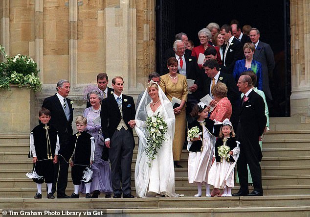 The newlyweds are joined by members of the Royal Family on the steps of St. George's Chapel