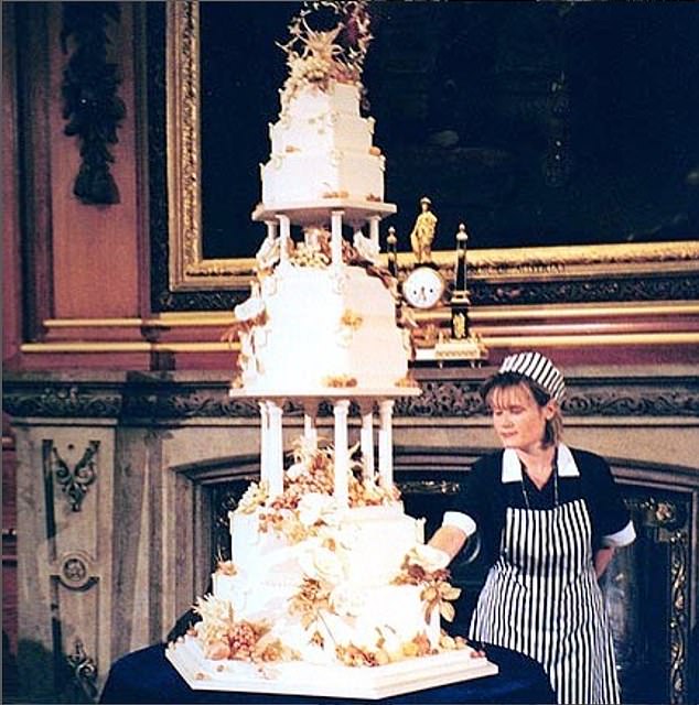 Linda Fripp shows off the three-metre tall fondant cake that took her more than 515 hours to make
