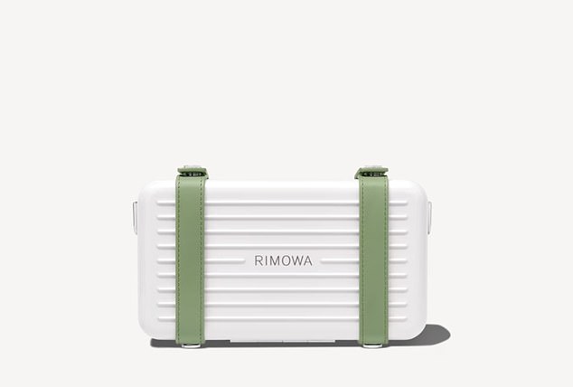 The last shopping bag Khan was holding was from RIMOWA.  It looked like she bought a crossbody bag (photo above)