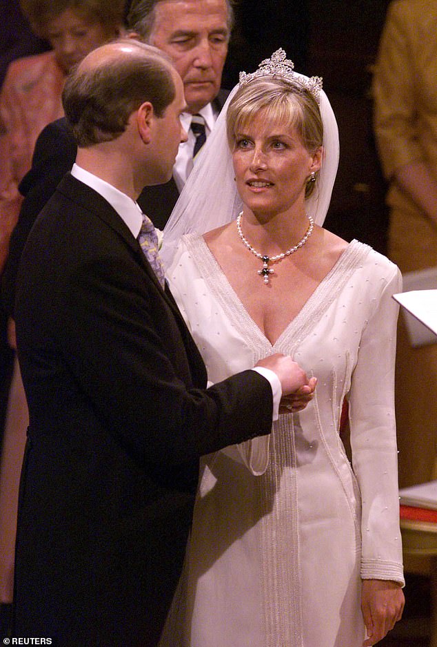 Prince Edward takes his bride Sophie's hand on their wedding day at St George's Chapel in Windsor, 25 years ago today