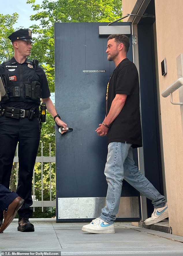 A blue-eyed Timberlake was seen emerging from the Hamptons Police Station in handcuffs
