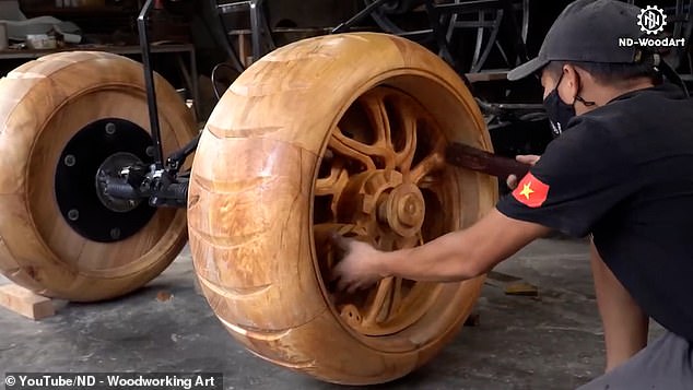Every other part, including the huge wooden wheels, is hand-carved from wood and attached to the frame