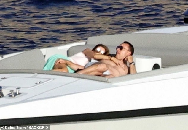 Terry stripped down to his swimming trunks for a sunbath on the bow of the boat