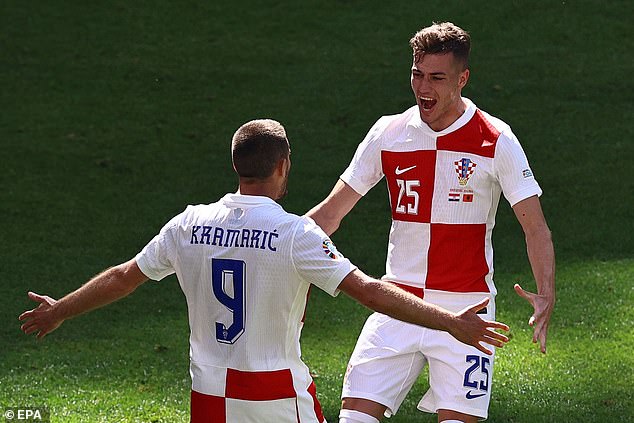 However, Croatia came from behind, with their first goal scored by Andrej Kramaric (left)