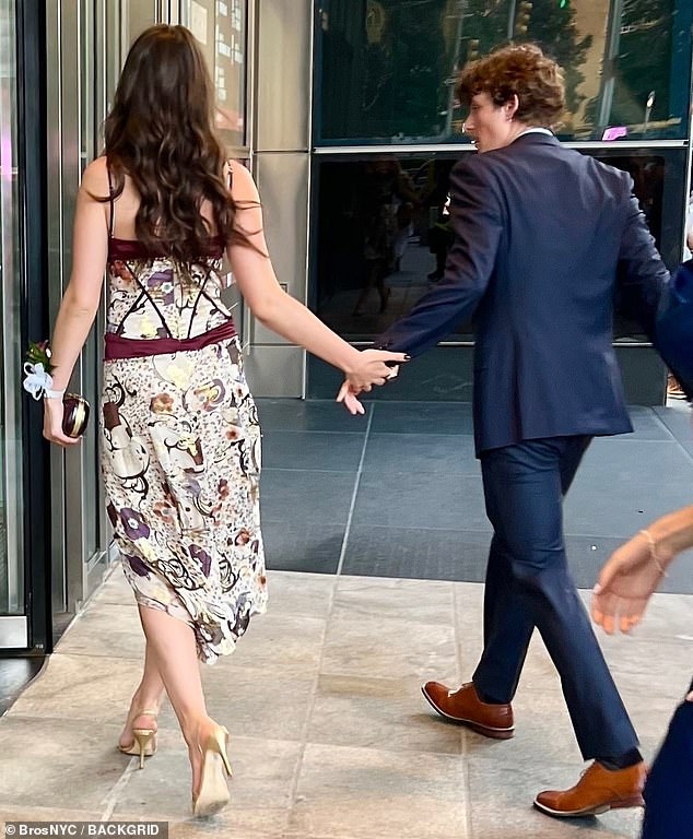The daughter of Katie Holmes and Tom Cruise was spotted holding hands with young singer Toby Cohen on Wednesday as she headed to her high school dance in New York
